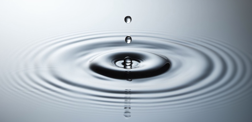 water droplet into a small pool of water